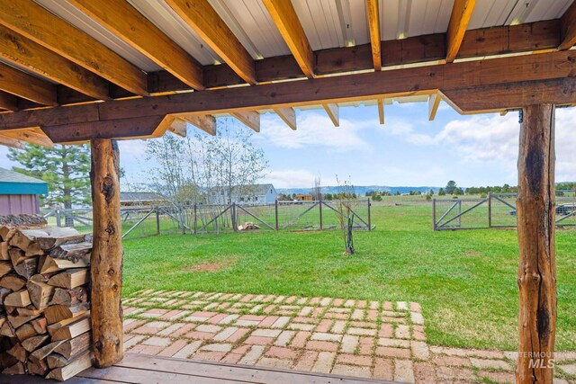 view of yard featuring a patio area and a gate