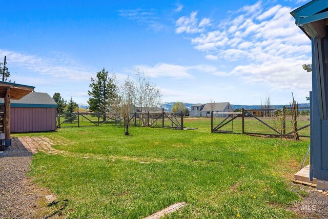 view of yard with a gate