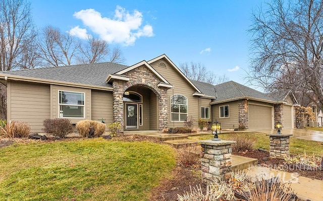 view of front facade featuring a garage and a front lawn