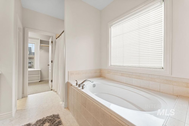 bathroom featuring tiled bath