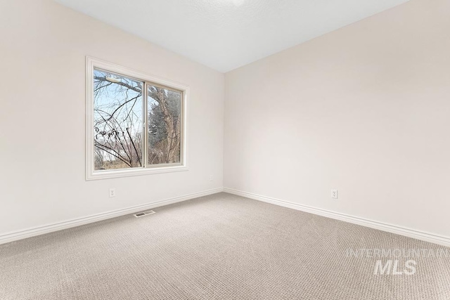 view of carpeted spare room