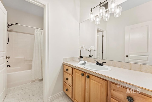 bathroom featuring vanity and shower / tub combo with curtain