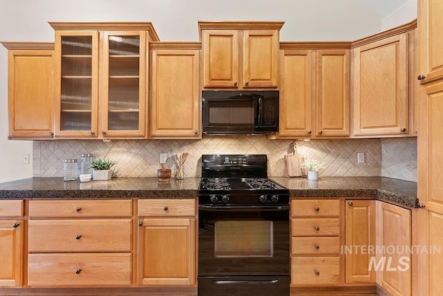 kitchen featuring backsplash, light brown cabinetry, and black appliances