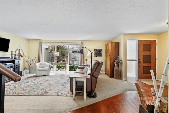 3001 S Roosevelt St Unit 9, Boise, ID 83705 - living room with a textured ceiling, baseboards, and wood finished floors