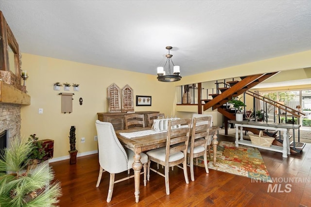 3001 S Roosevelt St Unit 9, Boise, ID 83705 - dining area featuring stairs, wood finished floors, a chandelier, and baseboards
