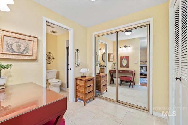 3001 S Roosevelt St Unit 9, Boise, ID 83705 - bathroom featuring toilet, tile patterned floors, vanity, and a closet