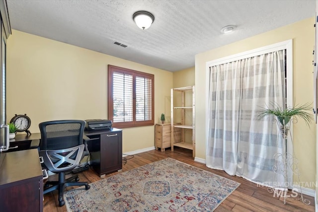3001 S Roosevelt St Unit 9, Boise, ID 83705 - office space with a textured ceiling, wood finished floors, and baseboards