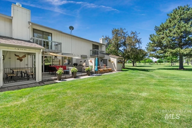 3001 S Roosevelt St Unit 9, Boise, ID 83705 - view of grassy yard with a balcony and a patio area