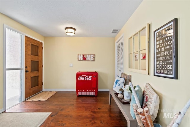 3001 S Roosevelt St Unit 9, Boise, ID 83705 - entryway with wood finished floors, baseboards, and a textured ceiling