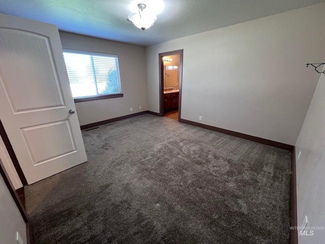 322 Linden Ave, Twin Falls, ID 83301 - unfurnished bedroom featuring carpet floors, baseboards, and ensuite bath