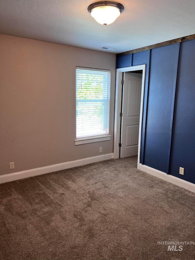 322 Linden Ave, Twin Falls, ID 83301 - unfurnished bedroom featuring carpet, baseboards, and a closet