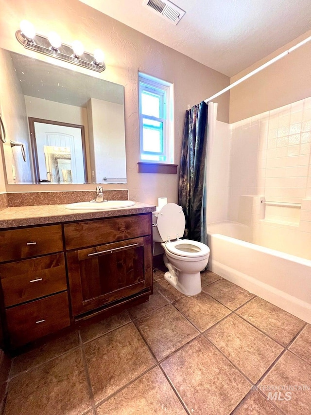 322 Linden Ave, Twin Falls, ID 83301 - full bath featuring toilet, shower / bath combination with curtain, vanity, and tile patterned flooring