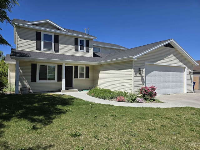 322 Linden Ave, Twin Falls, ID 83301 - traditional home with a garage, concrete driveway, and a front yard