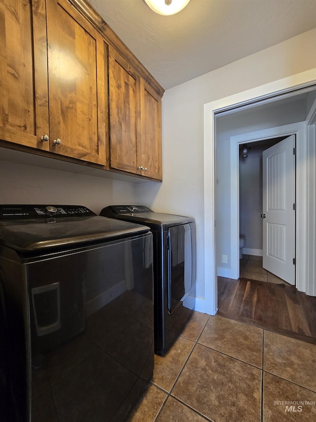 322 Linden Ave, Twin Falls, ID 83301 - laundry room with washing machine and clothes dryer, tile patterned floors, cabinet space, and baseboards