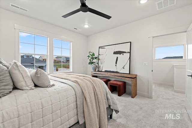 carpeted bedroom featuring ceiling fan