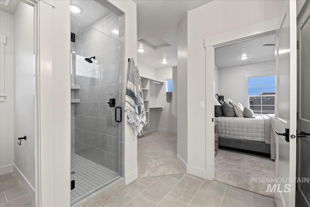 bathroom featuring an enclosed shower and tile patterned flooring