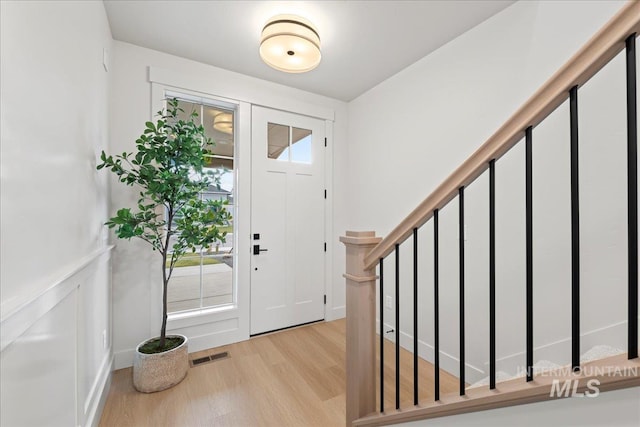 foyer with light hardwood / wood-style floors