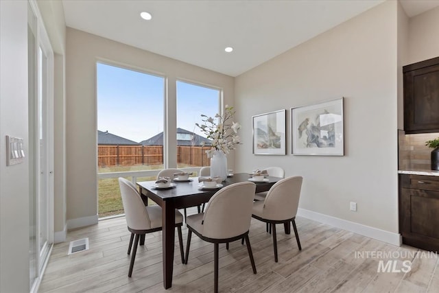 dining room featuring visible vents, recessed lighting, light wood-type flooring, and baseboards