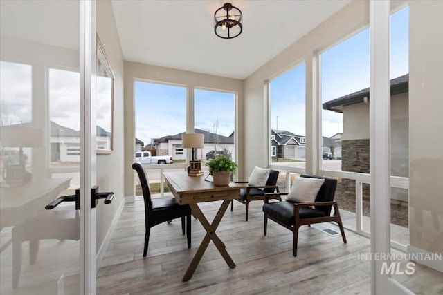 sunroom / solarium featuring a healthy amount of sunlight