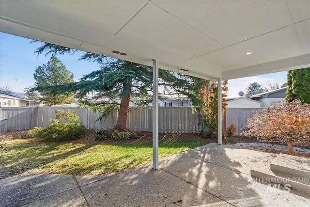 view of patio featuring fence