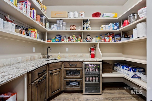 pantry with sink and wine cooler