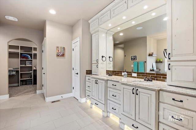 bathroom with tile patterned floors and vanity