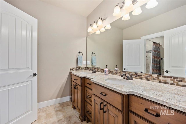 bathroom with vanity and backsplash