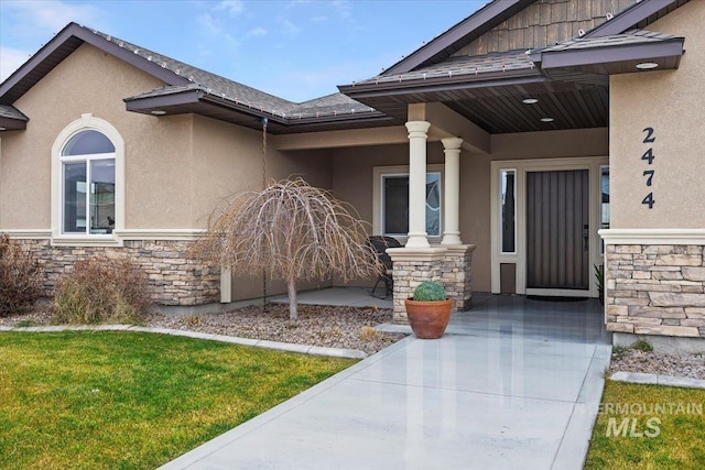 doorway to property with a porch