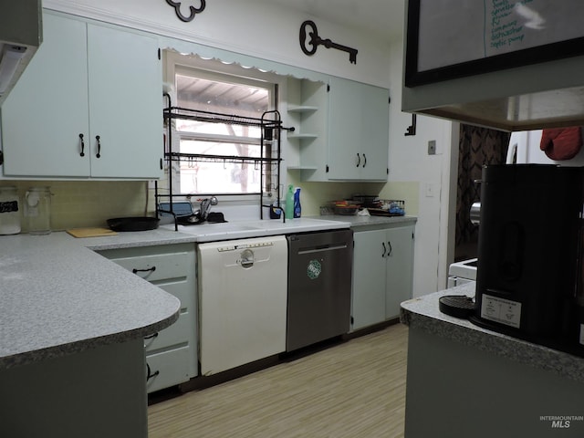 kitchen with open shelves, white dishwasher, light countertops, and stainless steel dishwasher