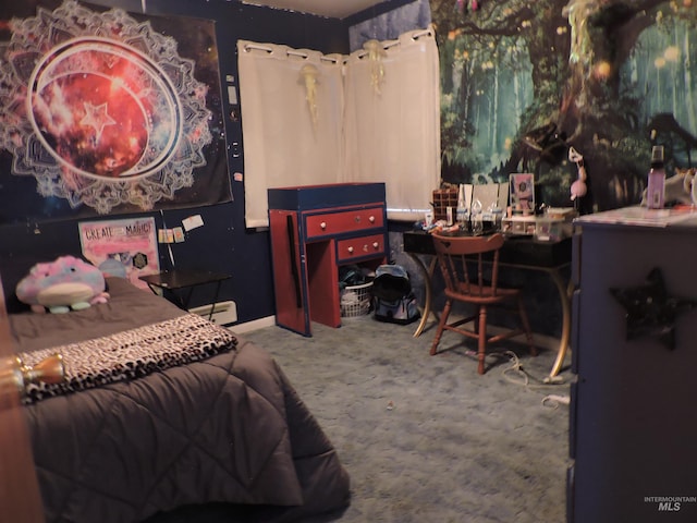 bedroom featuring a baseboard radiator, baseboards, and carpet flooring