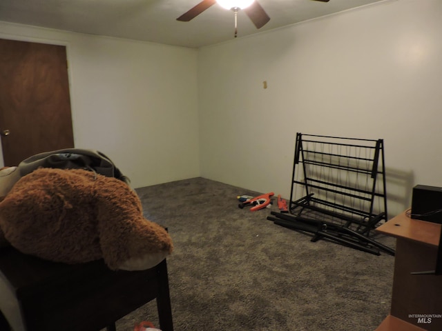 bedroom with a ceiling fan and carpet