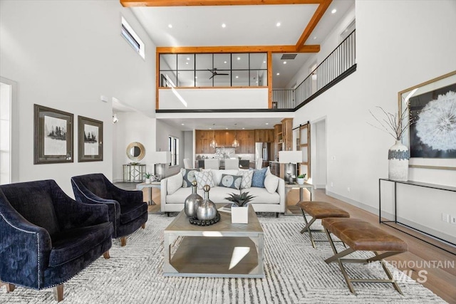 8860 Kemp Rd, Middleton, ID 83607 - living area featuring a towering ceiling and baseboards
