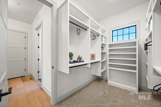 8860 Kemp Rd, Middleton, ID 83607 - walk in closet featuring light wood finished floors