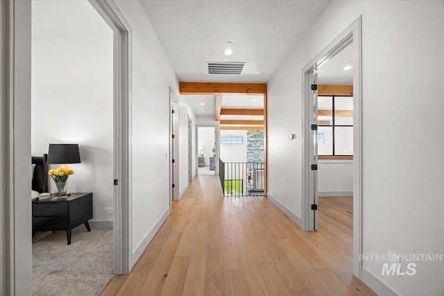 8860 Kemp Rd, Middleton, ID 83607 - hall with light wood-style flooring, baseboards, and recessed lighting