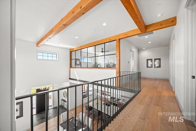 8860 Kemp Rd, Middleton, ID 83607 - hallway with beamed ceiling, wood-type flooring, recessed lighting, baseboards, and an upstairs landing