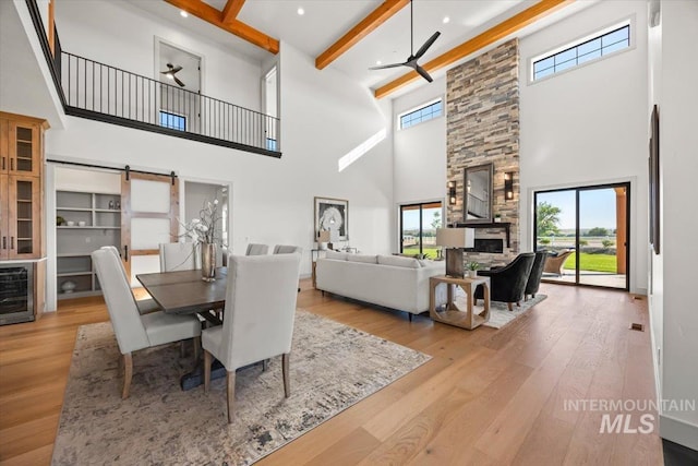 8860 Kemp Rd, Middleton, ID 83607 - dining area with a high ceiling, plenty of natural light, beamed ceiling, wood-type flooring, and recessed lighting