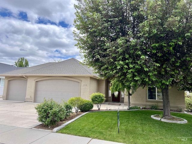 315 Shadetree Trl, Twin Falls, ID 83301 - view of front of property with a garage, stucco siding, driveway, and a front yard