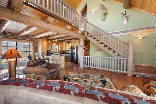 living room featuring beamed ceiling, dark hardwood / wood-style flooring, and wood ceiling