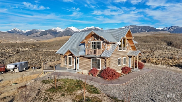 log cabin with a mountain view