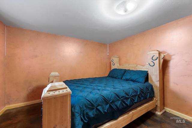 bedroom featuring dark hardwood / wood-style flooring