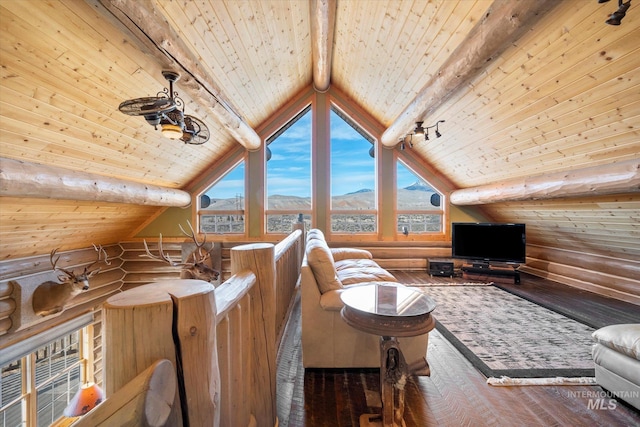 interior space featuring wooden ceiling, a mountain view, log walls, and vaulted ceiling with beams