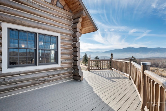 wooden deck featuring a mountain view