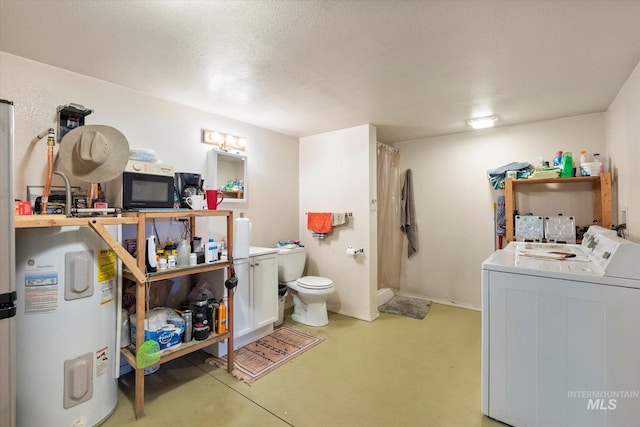 laundry room with water heater, a textured ceiling, and washer and dryer