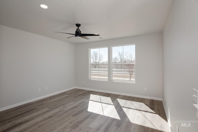 unfurnished room with baseboards, recessed lighting, ceiling fan, and wood finished floors
