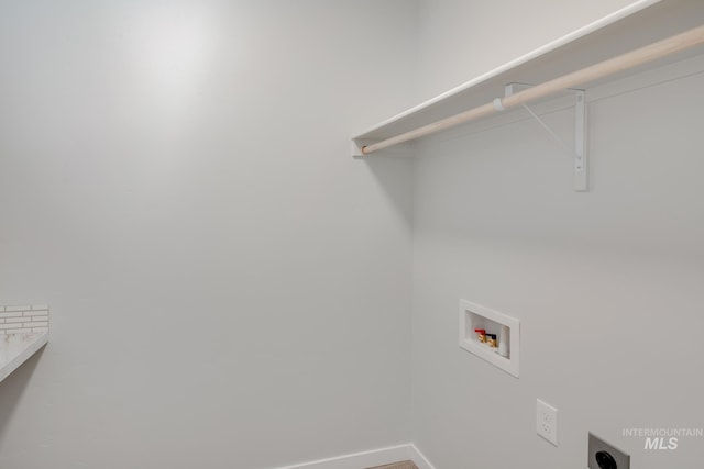 clothes washing area with washer hookup, baseboards, hookup for an electric dryer, and laundry area
