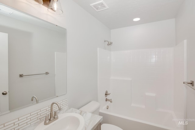 full bath featuring toilet, bathtub / shower combination, vanity, and visible vents