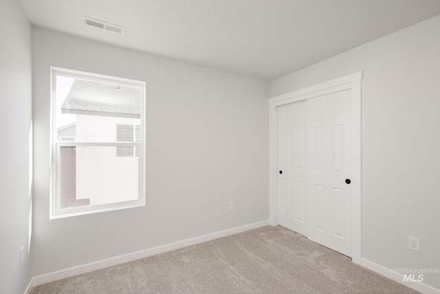 2779 N Rocky Bottom Way, Kuna, ID 83634 - unfurnished bedroom with carpet, baseboards, and a closet