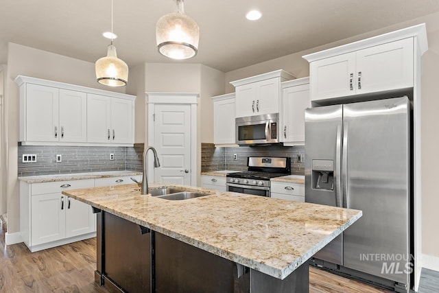 13991 W Milford Dr, Boise, ID 83713 - kitchen with appliances with stainless steel finishes, a sink, and white cabinetry