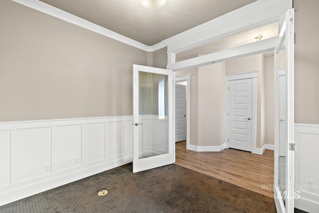 13991 W Milford Dr, Boise, ID 83713 - unfurnished bedroom featuring french doors, wainscoting, and ornamental molding