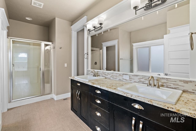 13991 W Milford Dr, Boise, ID 83713 - full bath with a shower stall, double vanity, tasteful backsplash, and baseboards